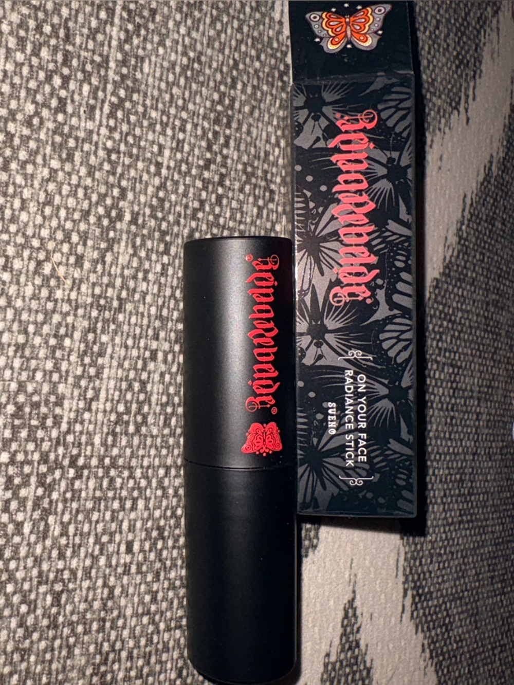 Reina Rebelde On Your Face Radiance Stick - Sueno (Black & Red Packaging)